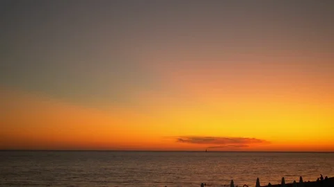 Seascape, red dramatic sunset on the sea. the sun colors the sea red. Vidéo 119025279