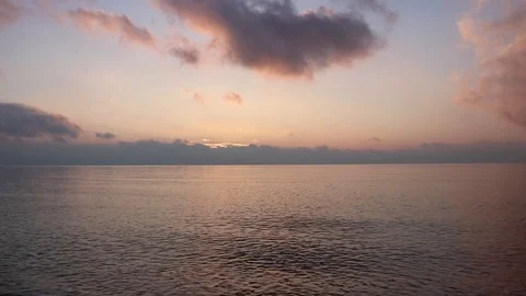 Seascape right after sunset. Pinkish colored clouds. Stock Footage 104335705