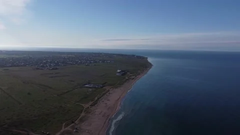 Seascape, sandy coastline and a small town near the sea. Beautiful seascape. Stock Footage 154764498