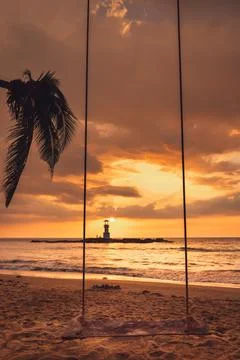 Seascape Scenery View With Empty Swing During Dramatic Cloudy at Sunset, Natu Stock Photos