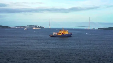 Seascape with a ship on the background of the Russian bridge. Stock Footage 135002271