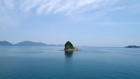 The seascape with the small island Stock Footage 93891353