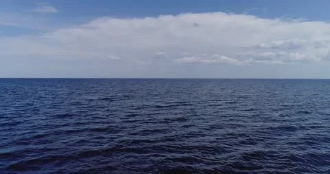 Seascape with small waves and beautiful white clouds Aerial view 4k  Stock Footage 156276473