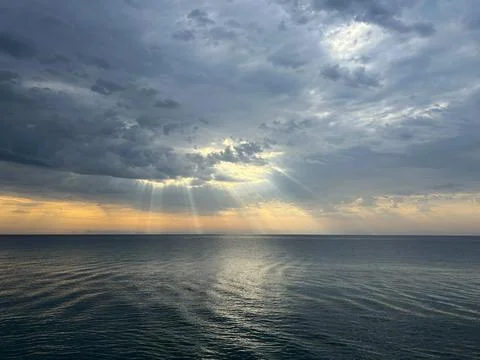 A seascape with sunbeams. 스톡 사진