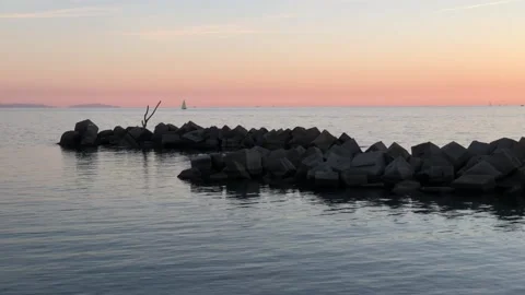 Seascape at sunset with breakwater Stock-Footage 166528010