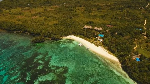 Seascape with tropical island, beach, resort, hotels. Bohol, Anda area Stock Footage