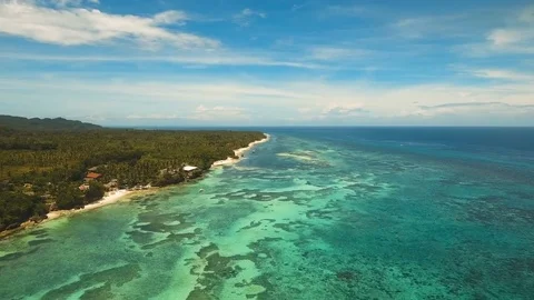 Seascape with tropical island, beach, resort, hotels. Bohol, Anda area Stock Footage