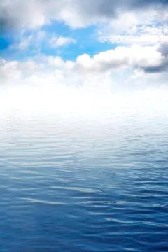 Seascape under blue sky with clouds Stock Photos