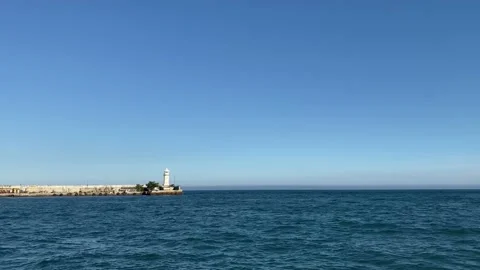 Seascape with a view of the white lighthouse. Yalta, Crimea Stock Footage 163596830