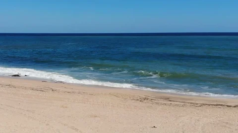 Seascape. Waves rolling on a sandy beach Stock Footage 102867170