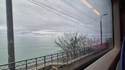 Seascapes outside the train window on the way to the sea Stock-Footage 308748097