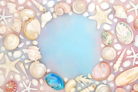 Seashell Border on Rainbow Sky Cloud Background Stock Photos