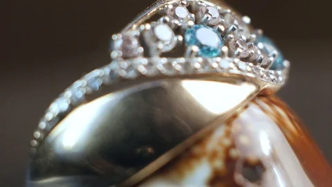 Seashell with jewelry rotates in macro Stock Footage 101103246