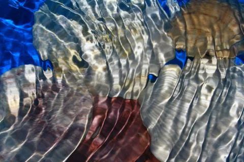 Seashell under water with waves Stock Photos