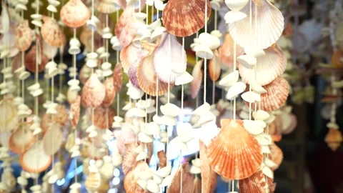 Seashell wind chimes at seaside boutique summer vibes Stock Footage 263383166