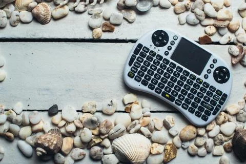 Seashells and mini keyboard Stock Photos