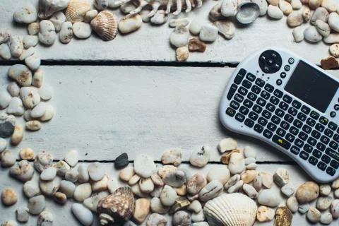 Seashells and mini keyboard Stock Photos