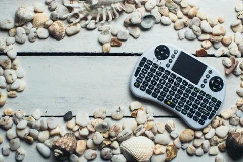 Seashells and mini keyboard Stock Photos