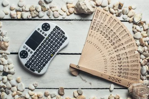 Seashells and mini keyboard Stock Photos