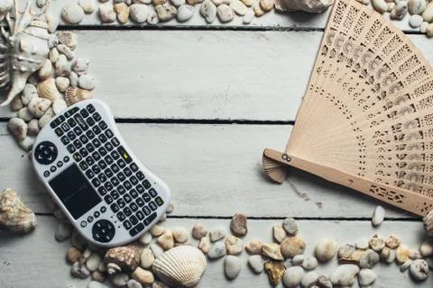 Seashells and mini keyboard Stock Photos