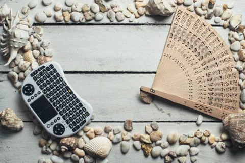 Seashells and mini keyboard Stock Photos