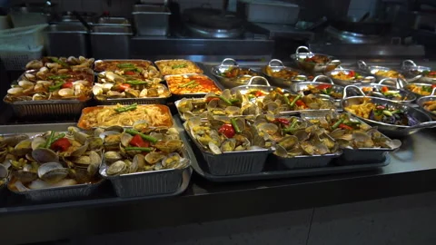 Seashells and Vegetable Meals at Display of Traditional Chinese Street Food Stock Footage 336411483