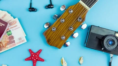 Seashells with a guitar and a camera Stock Footage 186131655