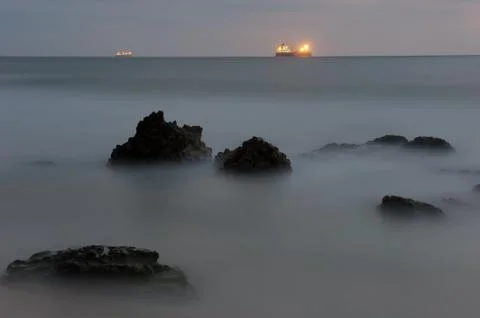 Seashore after sunset Stock Photos