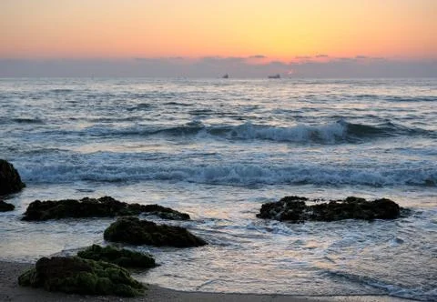 Seashore after sunset Stock Photos