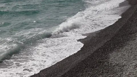 Seashore and waves, rocky beach, pebbles on the shore, calm sea view from above Stock Footage 166644997