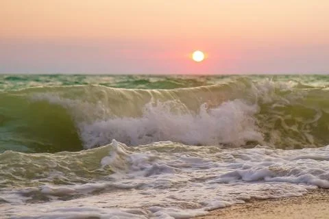 Seashore and waves on a sunset background. Foto stock