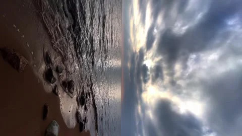Seashore cloudy sunset, small waves at the seashore Stock Footage 240954219