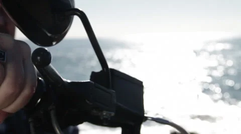 At the seashore Guy rotates hand tracking on the bike Stock Footage 35424917