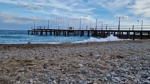 The seashore with a pier. Video stock 288185297