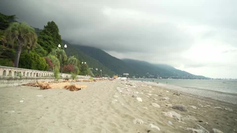 The seashore is polluted with various debris, such as plastic bottles and old Stock Footage 249448944