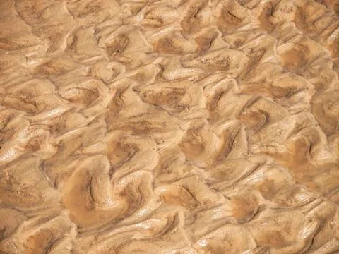 Seashore sand texture Stock Photos