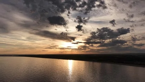 Seashore Sunset With Dramatic Clouds and Golden Nature Reflections Stock Footage 341865421