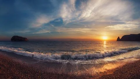 Seashore at sunset Stock Photos