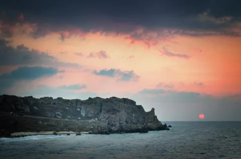 Seashore at sunset Stock Photos