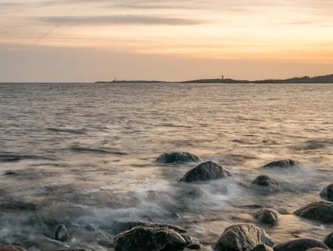 Seashore sunset Stock Photos