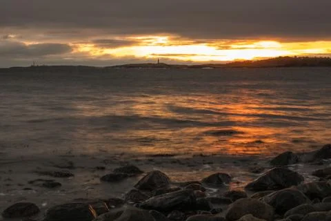 Seashore sunset Stock Photos