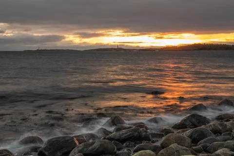 Seashore sunset Stock Photos