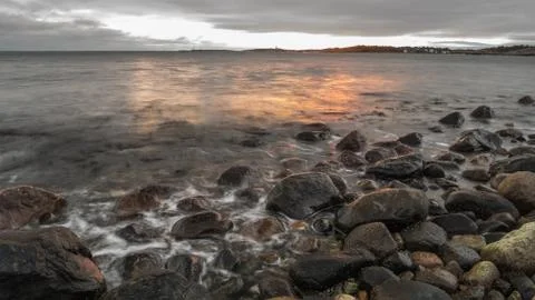 Seashore sunset Stock Photos