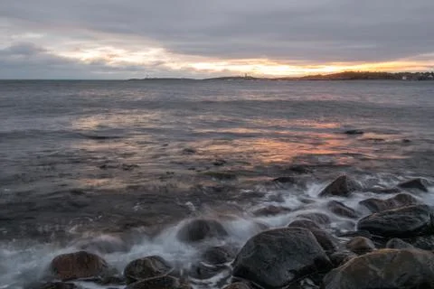 Seashore sunset Stock Photos