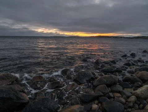 Seashore sunset Stock Photos