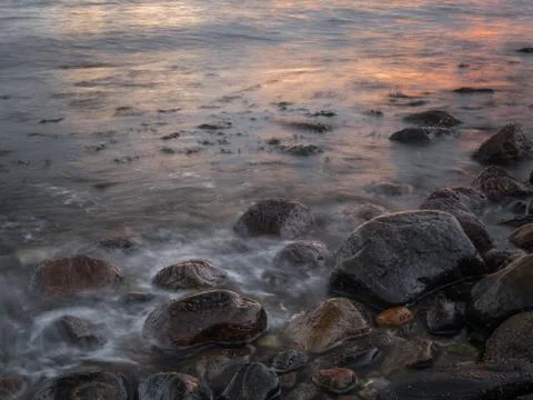 Seashore sunset Stock Photos