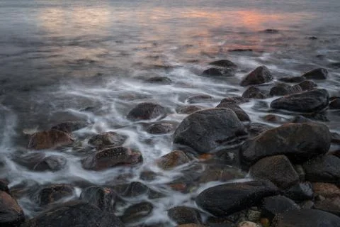 Seashore sunset Stock Photos