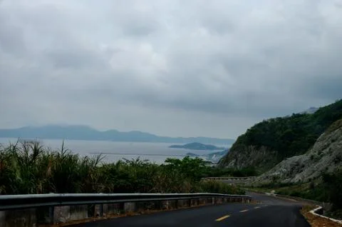 The seashore view on a cloudy day Stock Photos