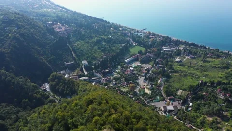 Seashore view landscape with green forest and red roofs of the houses in New Stock Footage 147935655
