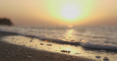 The seashore is washed by waves at sunset. Bottom view Stock Footage 135417980